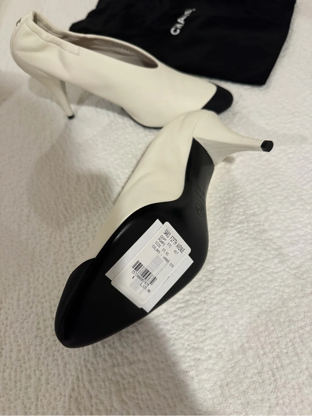 CHANEL Two-Tone White Leather Pumps with Black Cap Toe